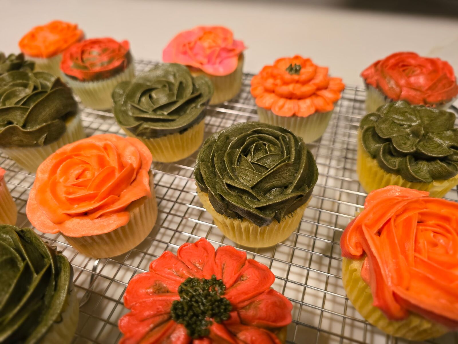 Baker's Blvd buttercream floral cupcakes piped in sage and coral